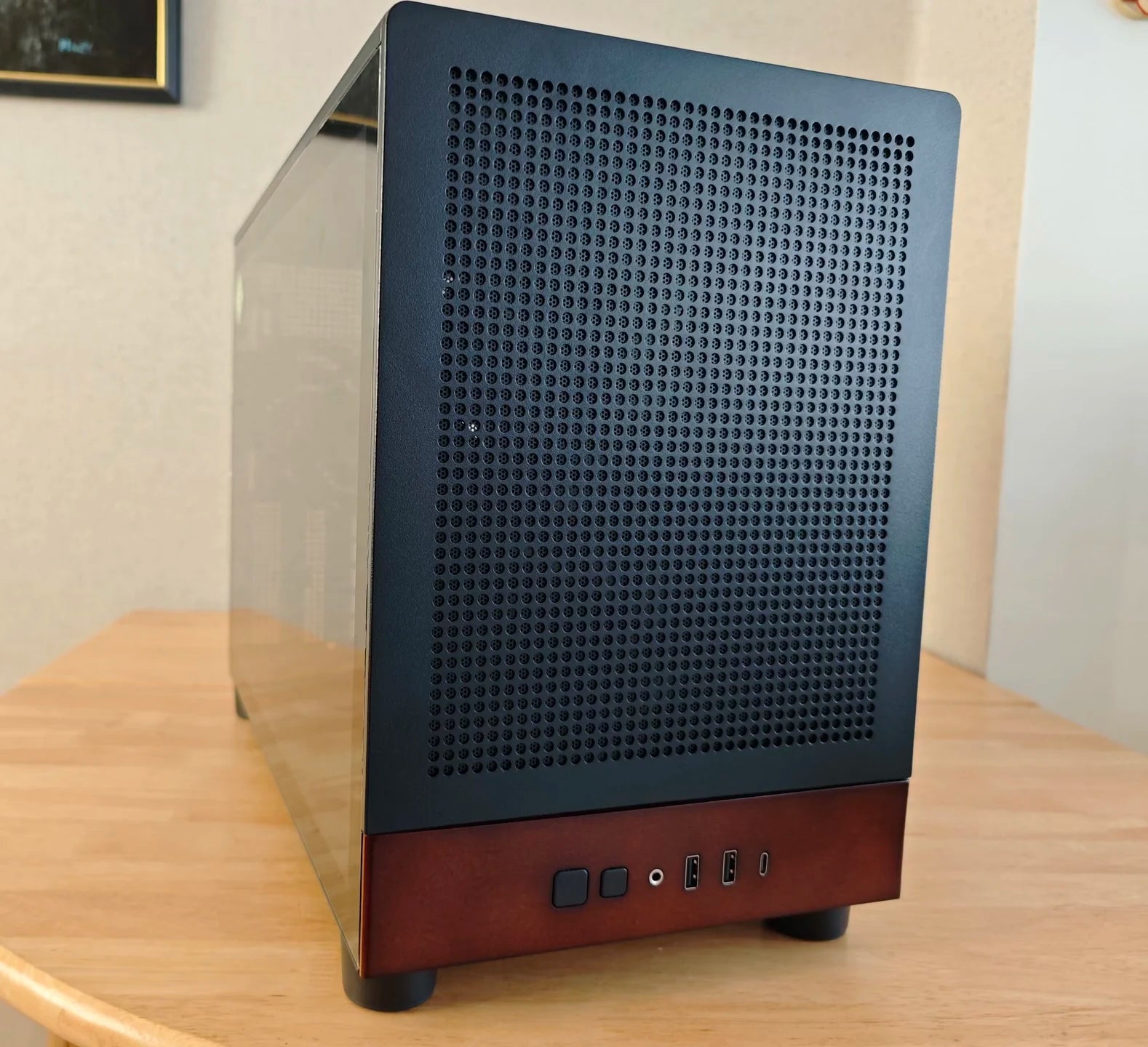 Computer case with a grid design on a wooden surface